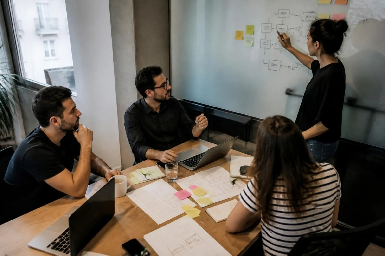 Planning session with wireframes and sticky notes
